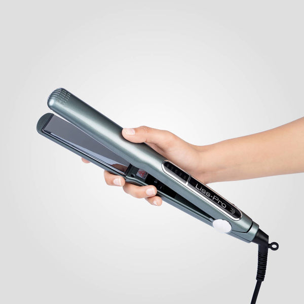 A hand holds a sleek gray Liss Pro Hair Straightener labeled "Lisse-Pro" against a plain background.